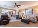 Living room with light brown walls and comfortable seating at 1542 E Chaparral Pl, Casa Grande, AZ 85122
