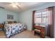 Charming bedroom with floral bedding and a window seat at 1542 E Chaparral Pl, Casa Grande, AZ 85122