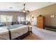 Spacious Primary bedroom with ceiling fan and ample closet space at 1542 E Chaparral Pl, Casa Grande, AZ 85122