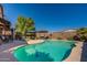 Inviting kidney-shaped pool with patio and lush landscaping at 1542 E Chaparral Pl, Casa Grande, AZ 85122