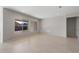 Spacious dining area with wood-look floors and large windows offering natural light at 16728 W Saguaro Park Ln, Surprise, AZ 85387