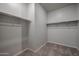 Large walk-in closet with plenty of shelving and hanging space at 40040 W Bravo Dr, Maricopa, AZ 85138