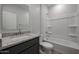 Bathroom with granite countertop vanity and bathtub at 40040 W Bravo Dr, Maricopa, AZ 85138