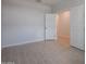 Bright bedroom with tile flooring and access to other rooms at 40040 W Bravo Dr, Maricopa, AZ 85138