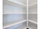 Bright walk-in pantry with ample shelving at 40040 W Bravo Dr, Maricopa, AZ 85138