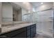 Bathroom boasts double sinks, granite countertops, and a large shower at 40040 W Bravo Dr, Maricopa, AZ 85138
