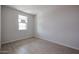 Spacious bedroom with tile flooring and large window at 40040 W Bravo Dr, Maricopa, AZ 85138