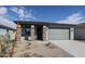 Newly constructed home with a gray exterior and 2 car garage at 40040 W Bravo Dr, Maricopa, AZ 85138