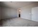 Spacious bedroom with carpeting and en-suite bathroom access at 40040 W Bravo Dr, Maricopa, AZ 85138