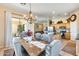 Dining area with chandelier and view into the kitchen at 8723 E Hillview St, Mesa, AZ 85207