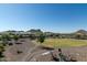 Large backyard with a circular lawn and fire pit at 331 W Dundy St, San Tan Valley, AZ 85143