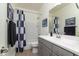 Bathroom with shower/tub combo and gray vanity at 331 W Dundy St, San Tan Valley, AZ 85143