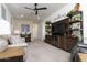 Bright bonus room with large TV stand and comfortable seating at 331 W Dundy St, San Tan Valley, AZ 85143