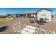 Landscaped backyard with firepit and seating at 331 W Dundy St, San Tan Valley, AZ 85143