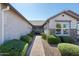 Inviting entryway with a paved walkway and lush landscaping at 331 W Dundy St, San Tan Valley, AZ 85143