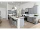 Modern kitchen with gray cabinets, white countertops, and a large island at 331 W Dundy St, San Tan Valley, AZ 85143