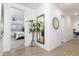 Bright hallway with a large mirror and view into bedroom at 331 W Dundy St, San Tan Valley, AZ 85143