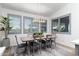 Bright dining room with a wood table and gray chairs at 331 W Dundy St, San Tan Valley, AZ 85143