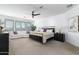 Spacious main bedroom with a king-size bed and sitting area at 331 W Dundy St, San Tan Valley, AZ 85143