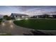 Large backyard with circular lawn and pathway at 331 W Dundy St, San Tan Valley, AZ 85143