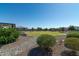 Expansive backyard with putting green and desert landscaping at 331 W Dundy St, San Tan Valley, AZ 85143