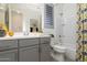 Bright bathroom with a bathtub and gray vanity at 331 W Dundy St, San Tan Valley, AZ 85143