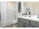 Clean bathroom with a shower/tub combo and gray vanity at 331 W Dundy St, San Tan Valley, AZ 85143