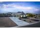 Single-story home with a three-car garage and landscaped yard at 331 W Dundy St, San Tan Valley, AZ 85143