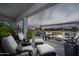 Relaxing covered patio with comfortable seating and fire pit at 331 W Dundy St, San Tan Valley, AZ 85143