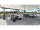 Relaxing covered patio with seating area, providing ample space for outdoor entertaining at 331 W Dundy St, San Tan Valley, AZ 85143