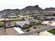 Aerial view of a house with a large backyard and mountain views at 331 W Dundy St, San Tan Valley, AZ 85143