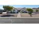 Single story home with brick accents and a well manicured lawn at 331 W Dundy St, San Tan Valley, AZ 85143