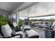 Covered patio with comfortable seating and a fire pit, perfect for outdoor relaxation at 331 W Dundy St, San Tan Valley, AZ 85143