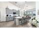 Modern kitchen with gray cabinets and an eat in area at 331 W Dundy St, San Tan Valley, AZ 85143