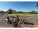 Firepit area with chairs in a spacious backyard at 331 W Dundy St, San Tan Valley, AZ 85143