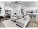 Open concept living room with a comfortable sectional sofa and kitchen views at 331 W Dundy St, San Tan Valley, AZ 85143
