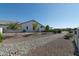 Backyard with gravel pathway and drought-tolerant landscaping at 331 W Dundy St, San Tan Valley, AZ 85143