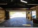 Spacious garage with built-in shelving and workbench at 1607 W Shangri La Rd, Phoenix, AZ 85029