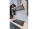 Sleek kitchen with a modern glass cooktop and stainless steel vent hood at 18083 W Amber Dr, Goodyear, AZ 85338