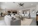 Open living room features stylish furniture and an adjoining kitchen at 18083 W Amber Dr, Goodyear, AZ 85338