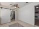 Bathroom with barn door and updated vanity at 12817 N 29Th Ave, Phoenix, AZ 85029