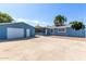 Home's exterior features a detached garage and a large paved area at 12817 N 29Th Ave, Phoenix, AZ 85029