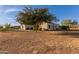 Exterior view of a one-story house and large yard at 1894 W Scissor Tail Pl, Queen Valley, AZ 85118