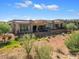 Back exterior of luxury home with a patio and landscaping at 16076 E Ridgestone Dr, Fountain Hills, AZ 85268