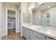 Modern bathroom with double vanity, large mirror, and walk-in shower at 16076 E Ridgestone Dr, Fountain Hills, AZ 85268