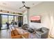 Bright living room with a cozy seating area and sliding glass doors leading to a patio at 16076 E Ridgestone Dr, Fountain Hills, AZ 85268