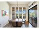 Elegant dining room with a large table and stunning views from large windows at 16076 E Ridgestone Dr, Fountain Hills, AZ 85268