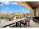 Covered patio features a built-in outdoor kitchen and bar seating at 16076 E Ridgestone Dr, Fountain Hills, AZ 85268