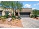Modern home exterior with stone and paver driveway at 16076 E Ridgestone Dr, Fountain Hills, AZ 85268