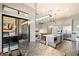 Modern dining room with a granite table and kitchen views at 16076 E Ridgestone Dr, Fountain Hills, AZ 85268
